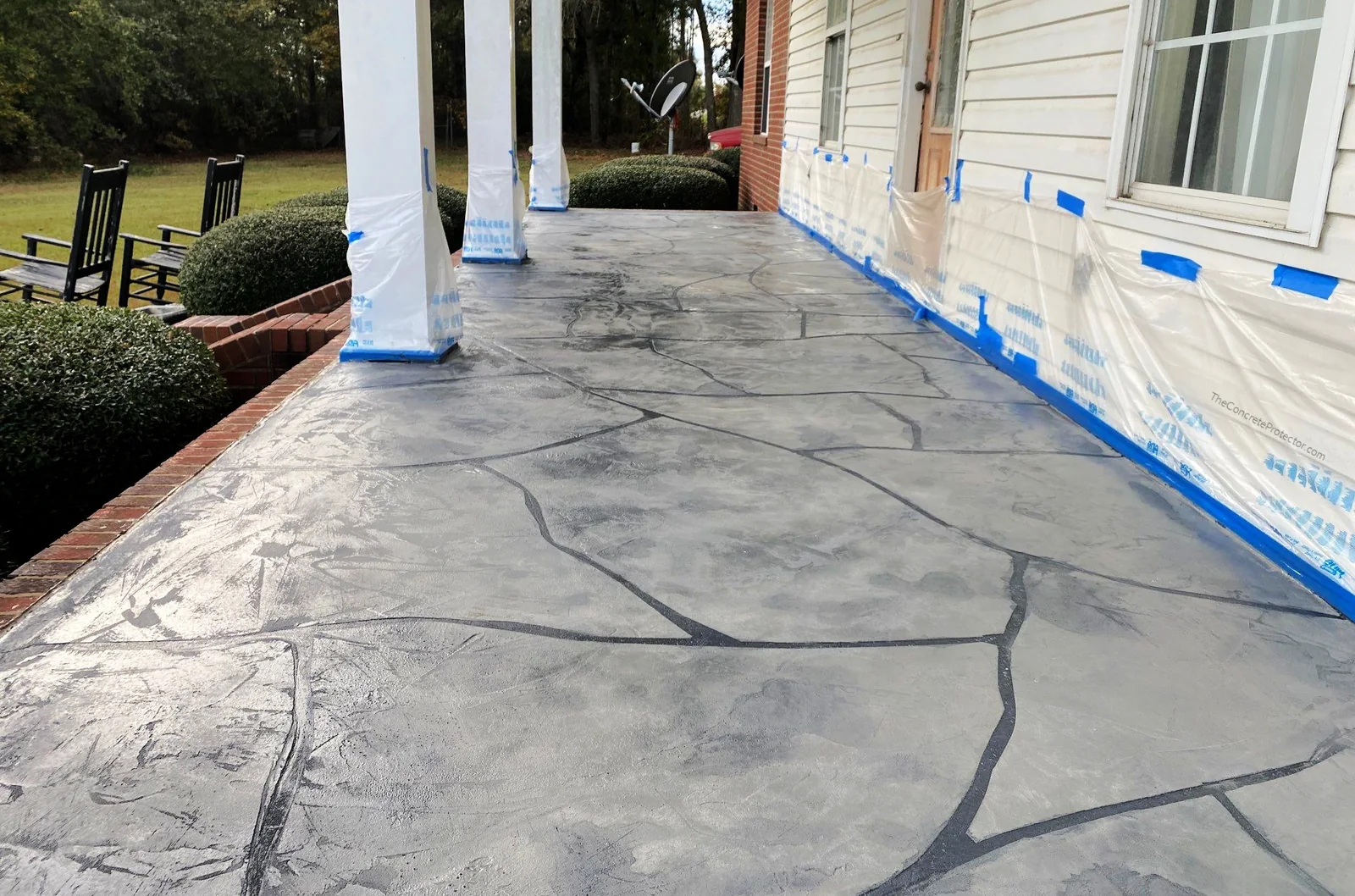 Grand Flagstone covered back porch in a gray blend