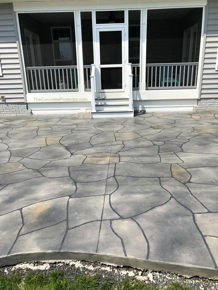 Grand Flagstone finish on a columned front porch in a tan blend