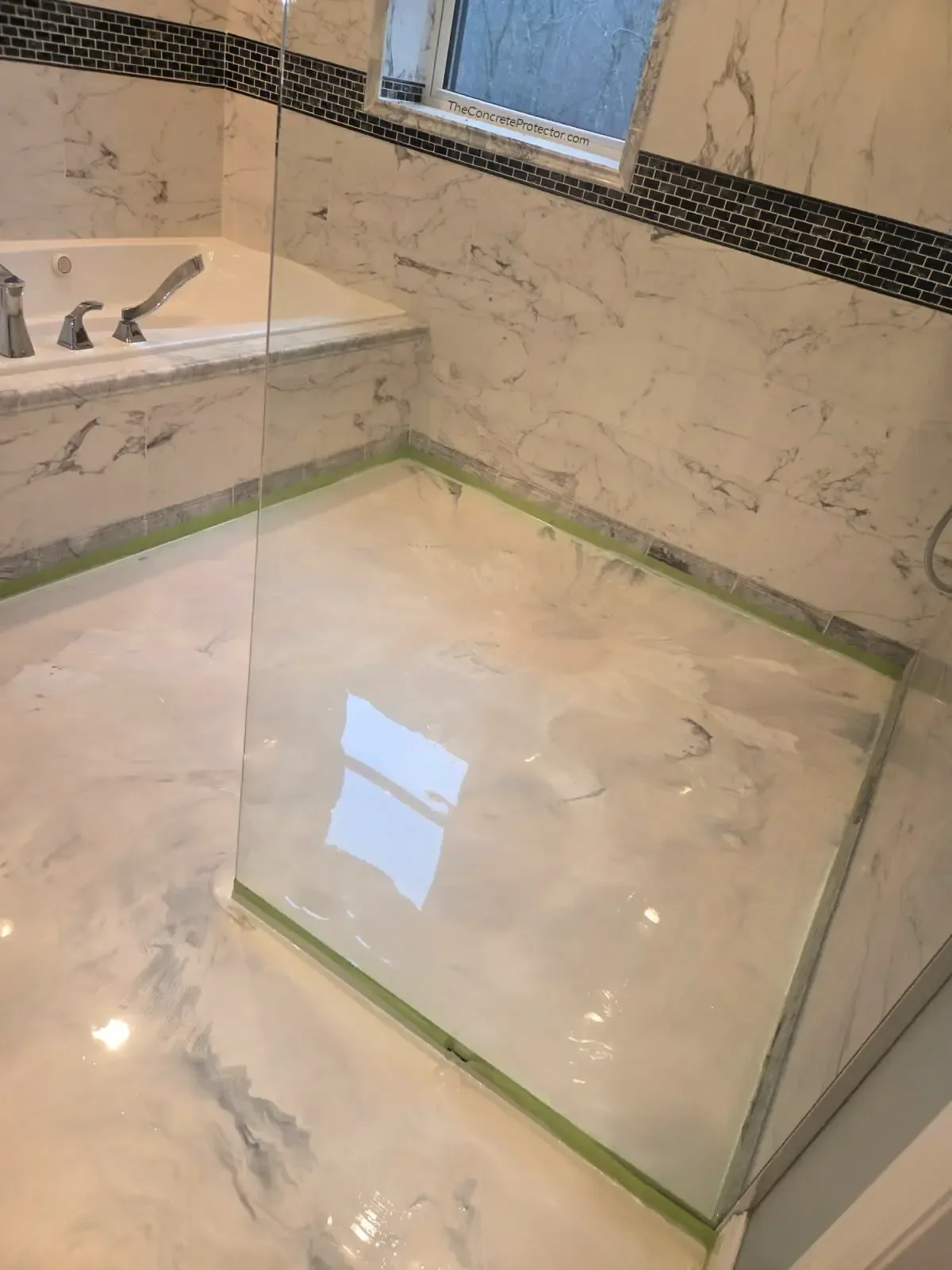 Italian Marble bathroom floor in soft white and grey veining carried into the shower pan