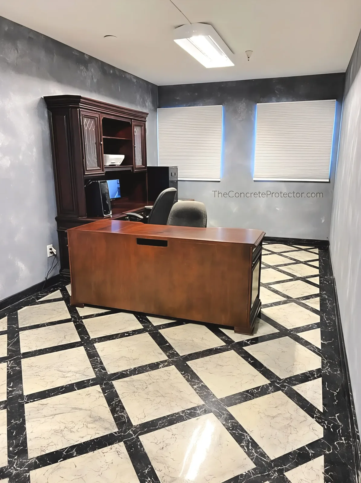 Italian Marble office floor in a cream and black grid pattern with a high-gloss finish