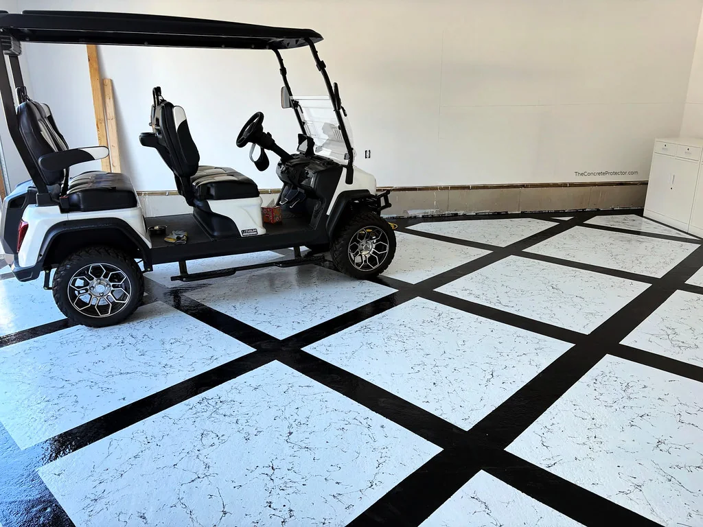 MarbleFlex garage floor in white marble with a black diamond grid, flexible and waterproof over concrete