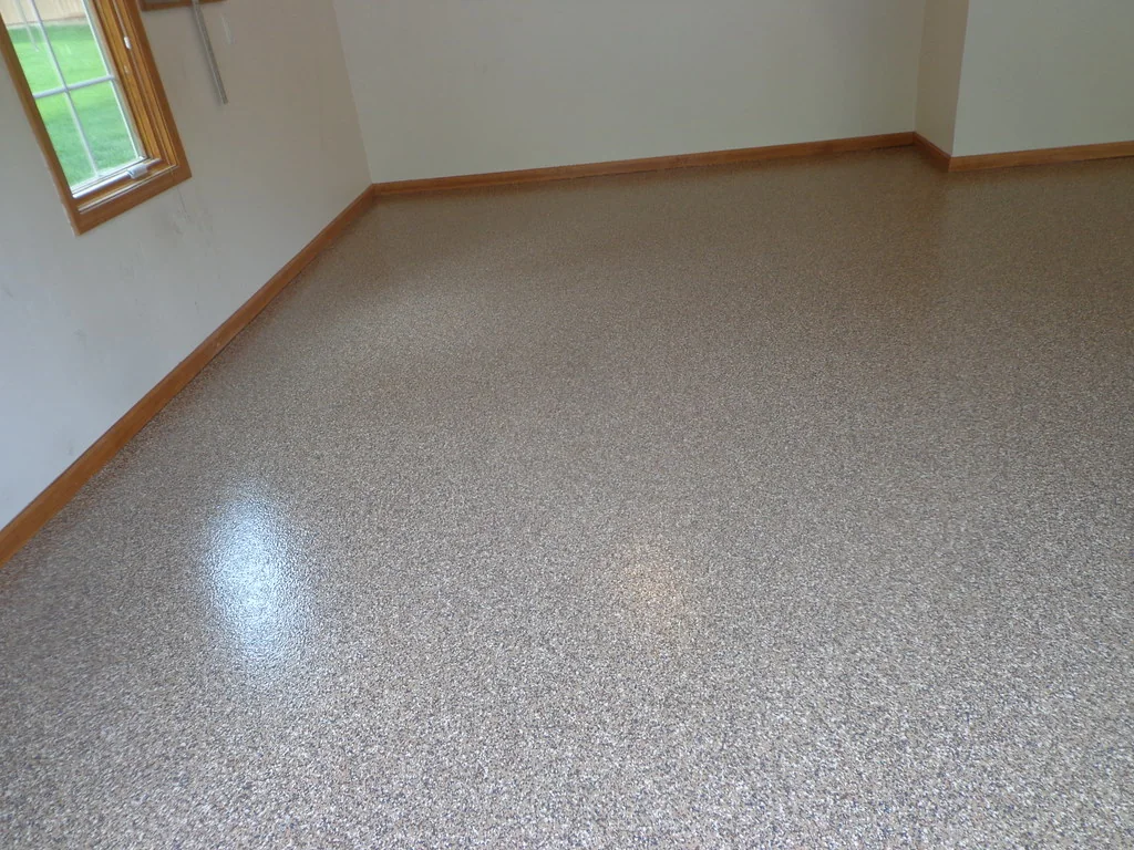Protector Color Flakes floor in a finished room with painted trim
