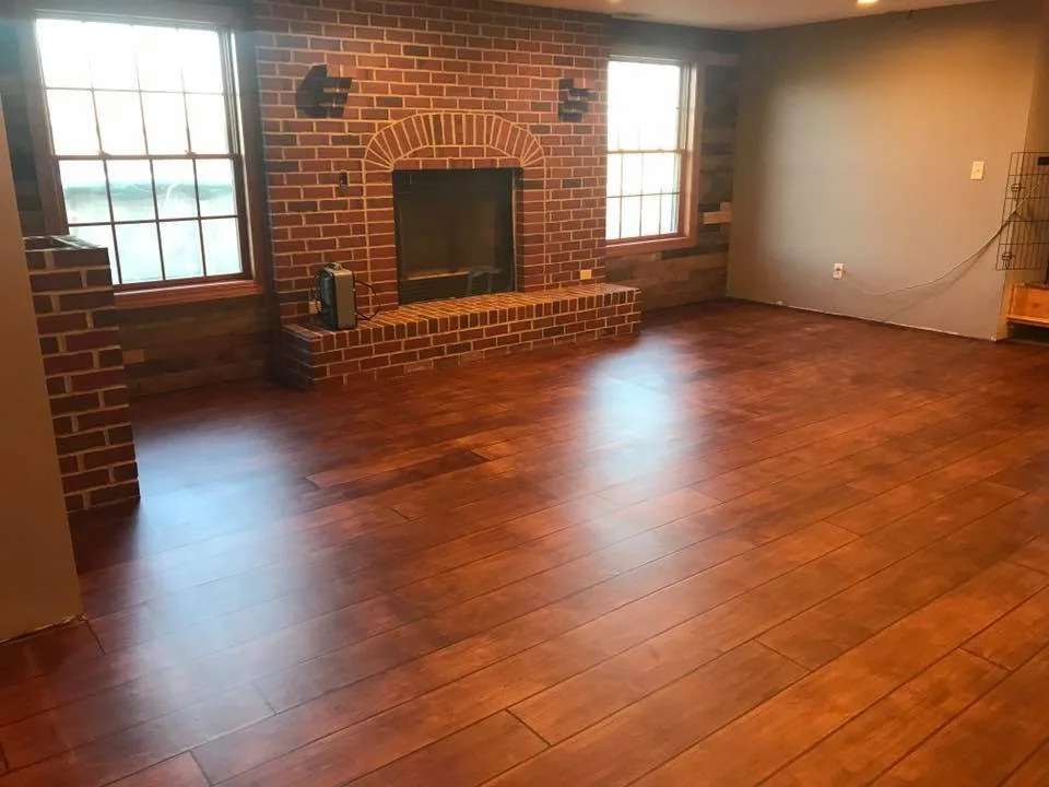 Rustic Concrete Wood plank finish on a finished basement floor