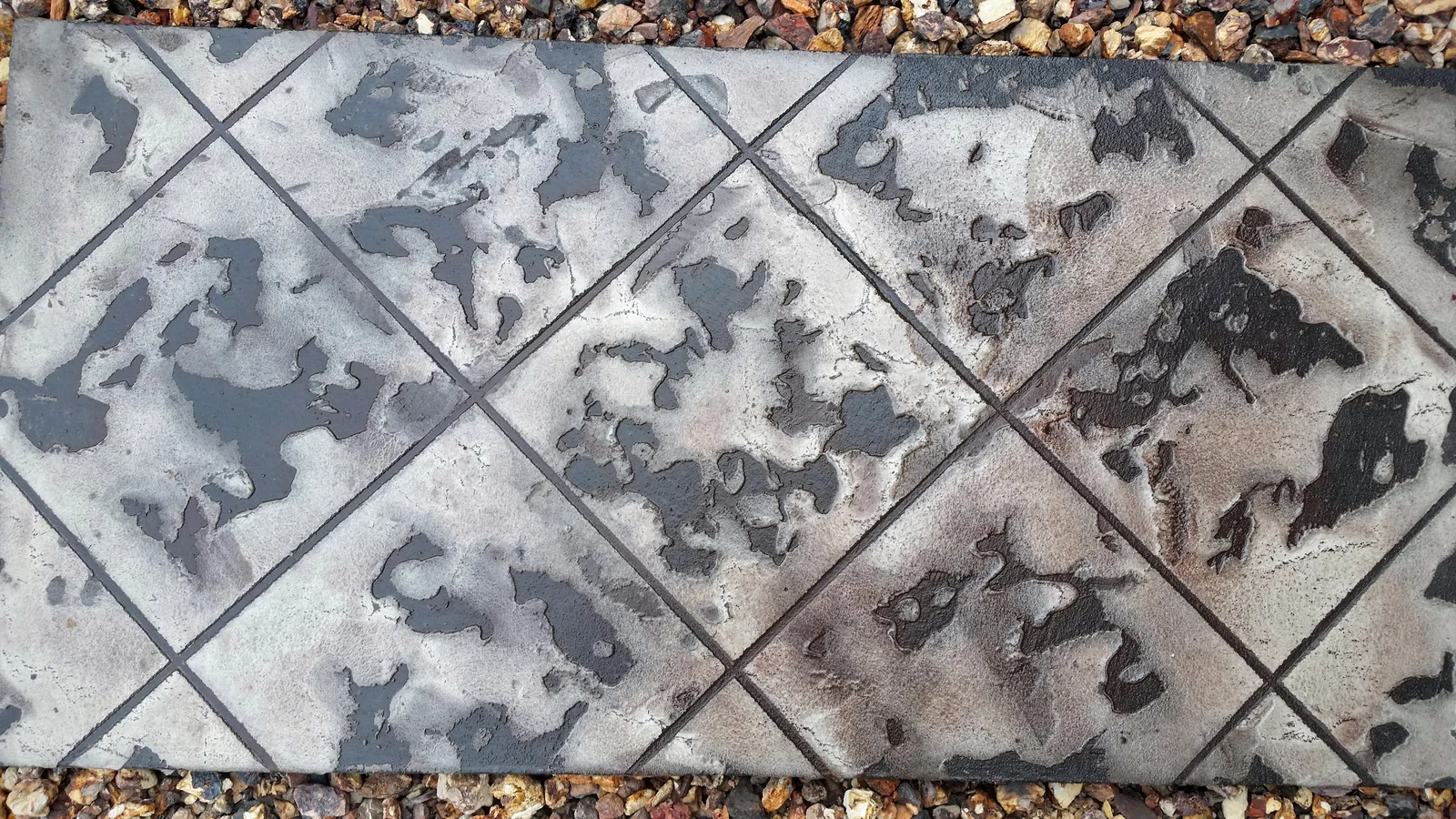 Tuscan Slate diagonal tile antiqued in brown and black over a light grey base